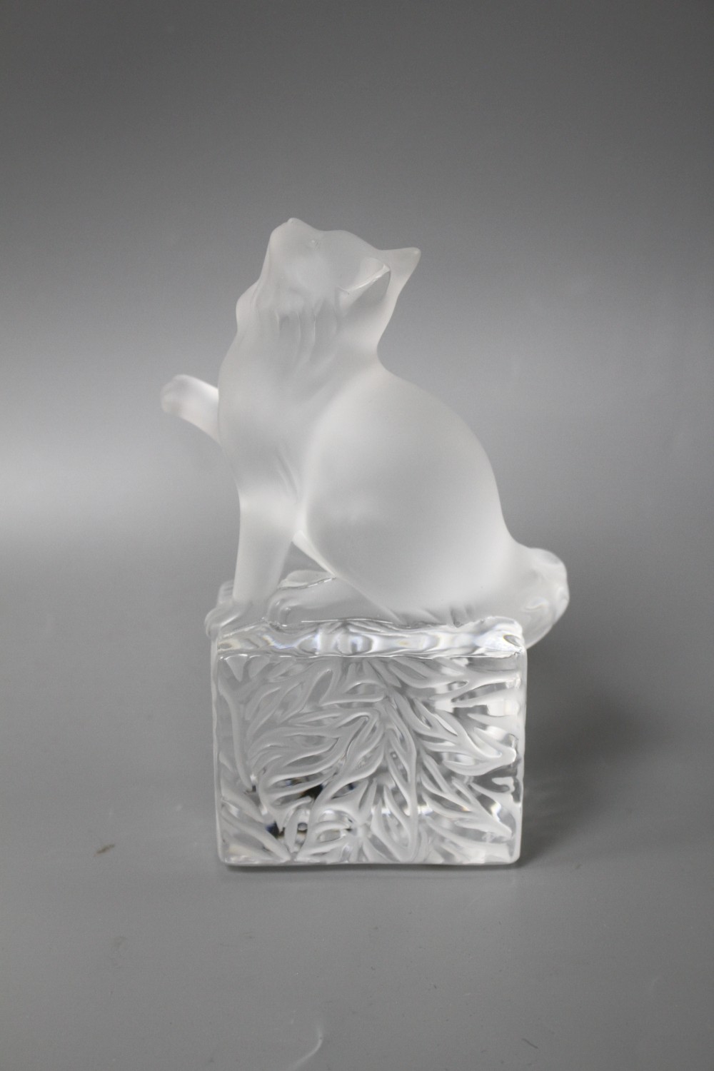 A modern Lalique frosted glass paperweight modelled as a seated cat, height 14.5cm, in original cardboard box,